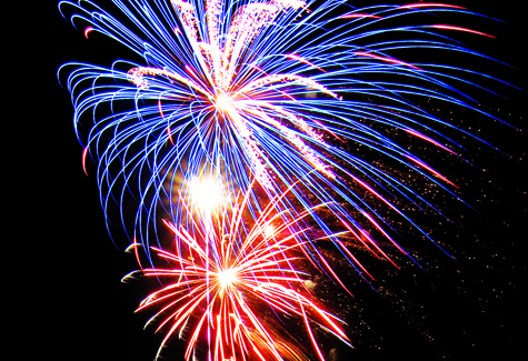 KATHARINE SCHROEDER PHOTO Red, white and blue fireworks light up the sky above the Polo Grounds in Greenport on Sunday night.